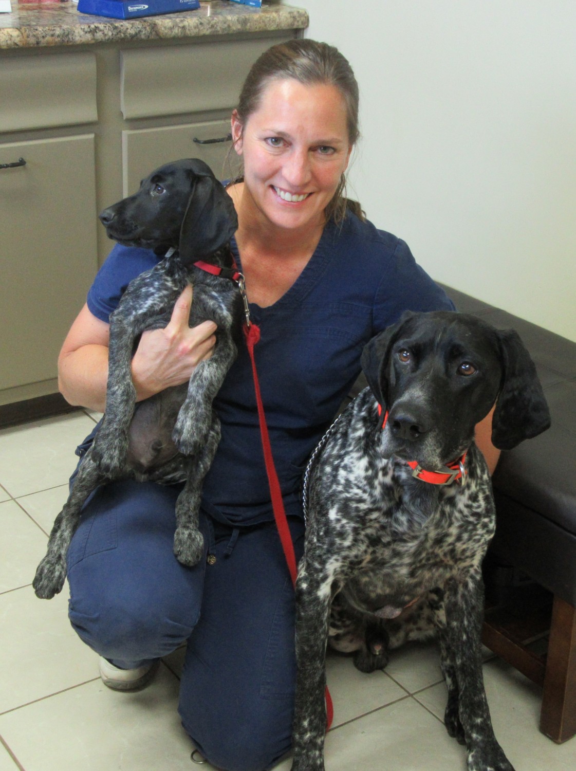 Dr. Christine Sherden DVM with 2 dogs